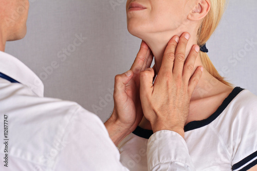 Woman getting thyroid gland control. Health care and medical concept photo