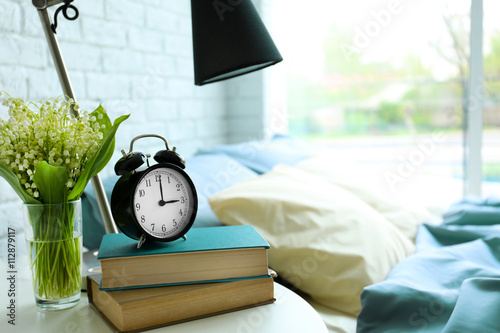 Lamp, books and flower bouq...