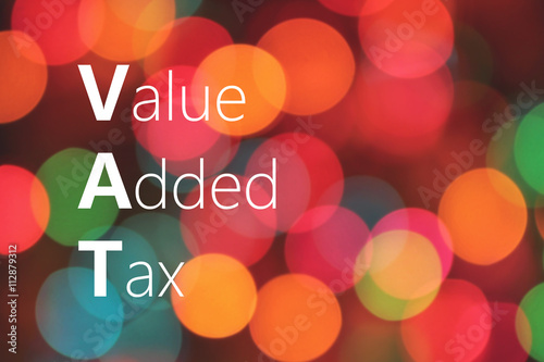 VAT (Value Added Tax) acronym on colorful bokeh background