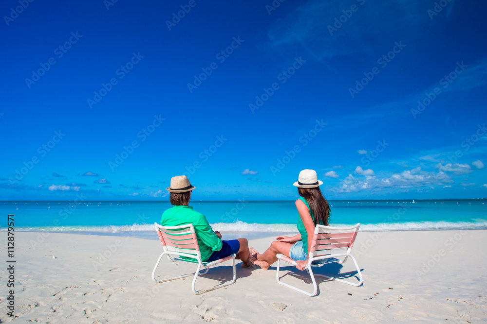 Young couple on white beach at summer vacation