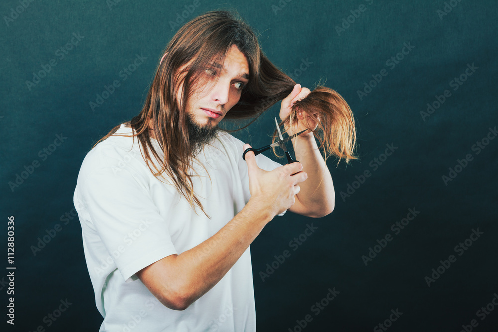 Fototapeta premium Barber cutting hair