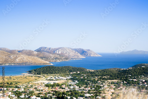 Landscape, mountains of the island and the sea and a small coastal village. Greece, Mediterranean Sea, Dodecanese, Athens