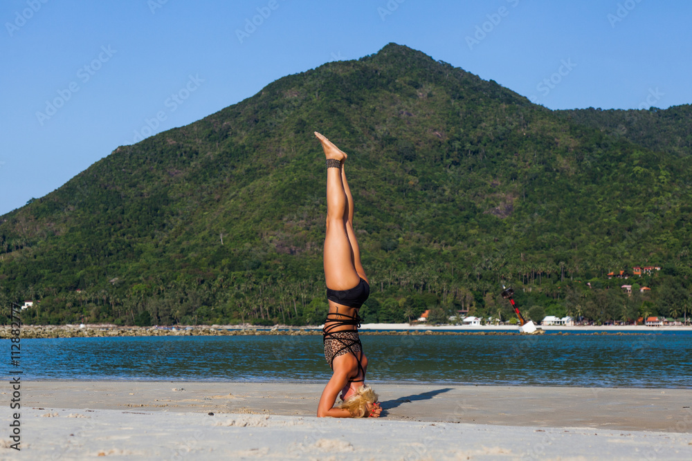 Yoga position on the beach Yoga position on the beach
