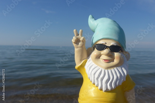 Garden gnome on vacation at sea  photo