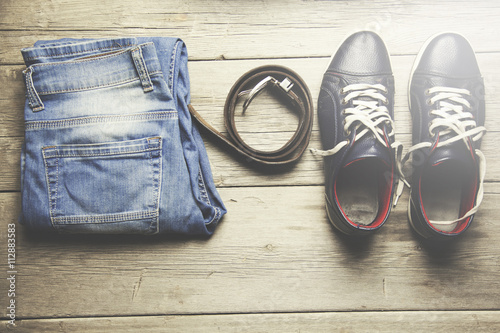 jeans, belt and sport shoes