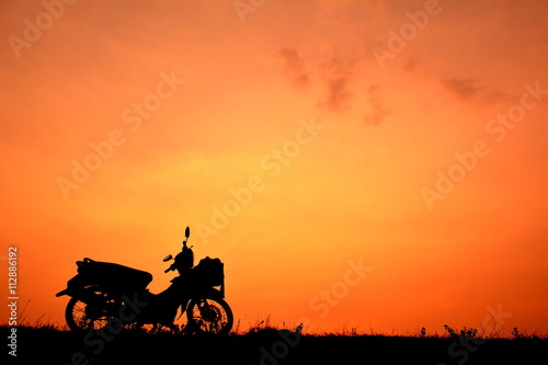 Tapety artystyczne Motorcycle at sky sunset