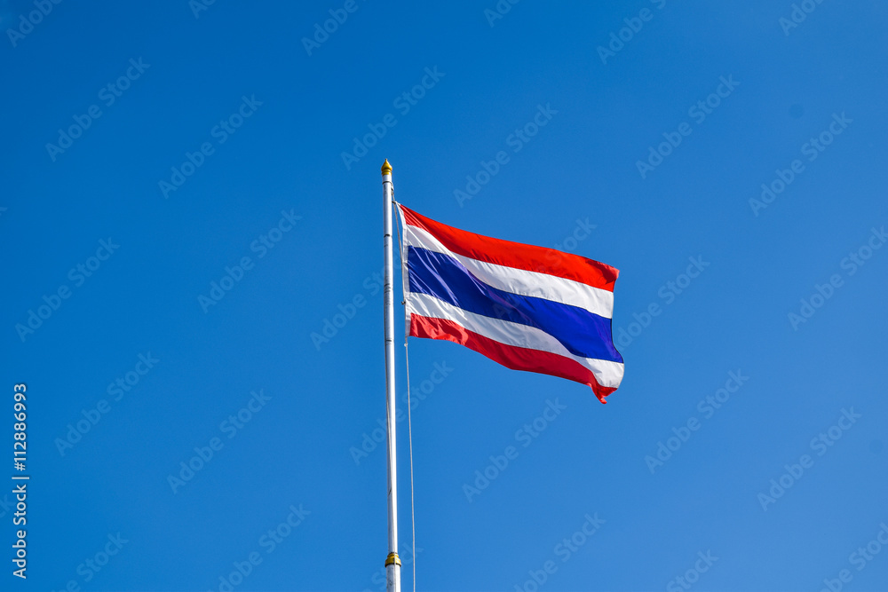 Thai flag of Thailand with blue sky background