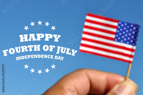 Happy Fourth of July greeting card with american flag in blue sky background