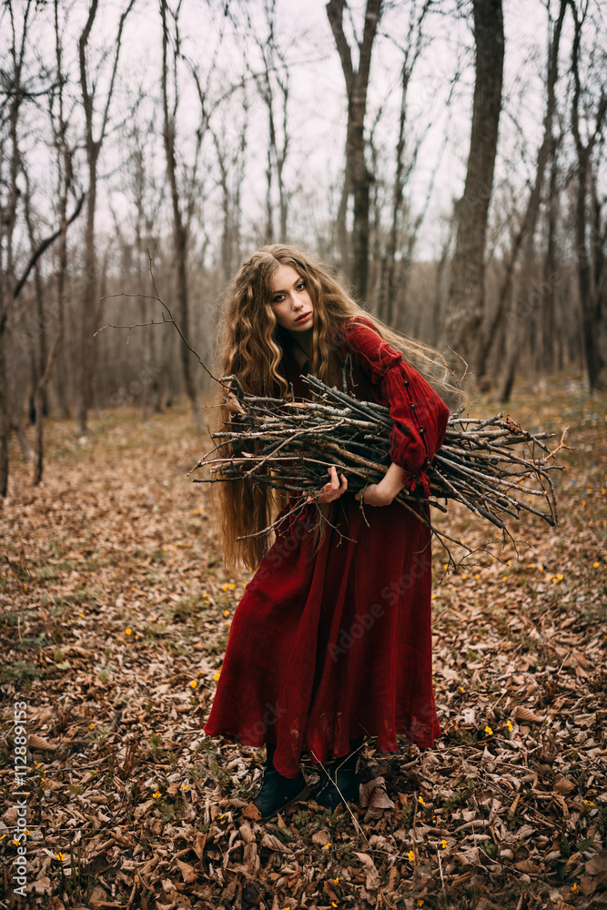 Young witch in the autumn forest Young witch in the autumn forest