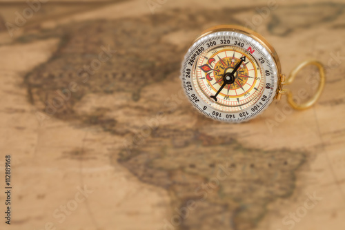 vintage compass on old map