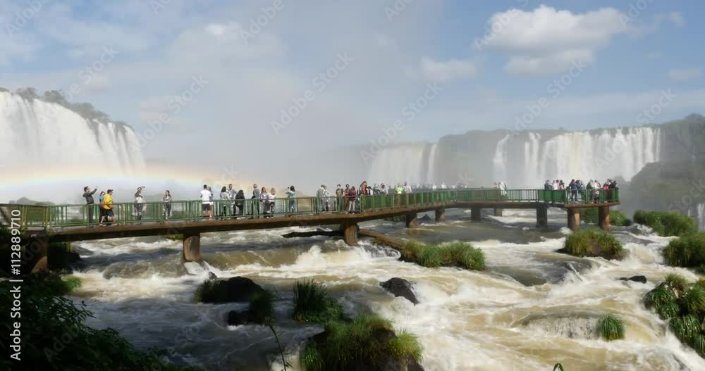 Tourists at Iguazu Falls on the border of Brazil and Argentina. Tourists at Iguazu Falls on the border of Brazil and Argentina.