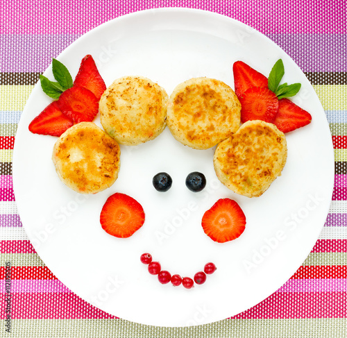 Creative idea for baby breakfast - cheese pancakes with berries