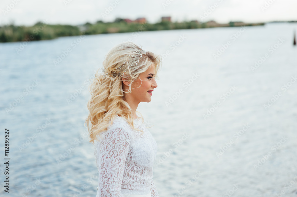 Beautiful young bride in luxury wedding dress