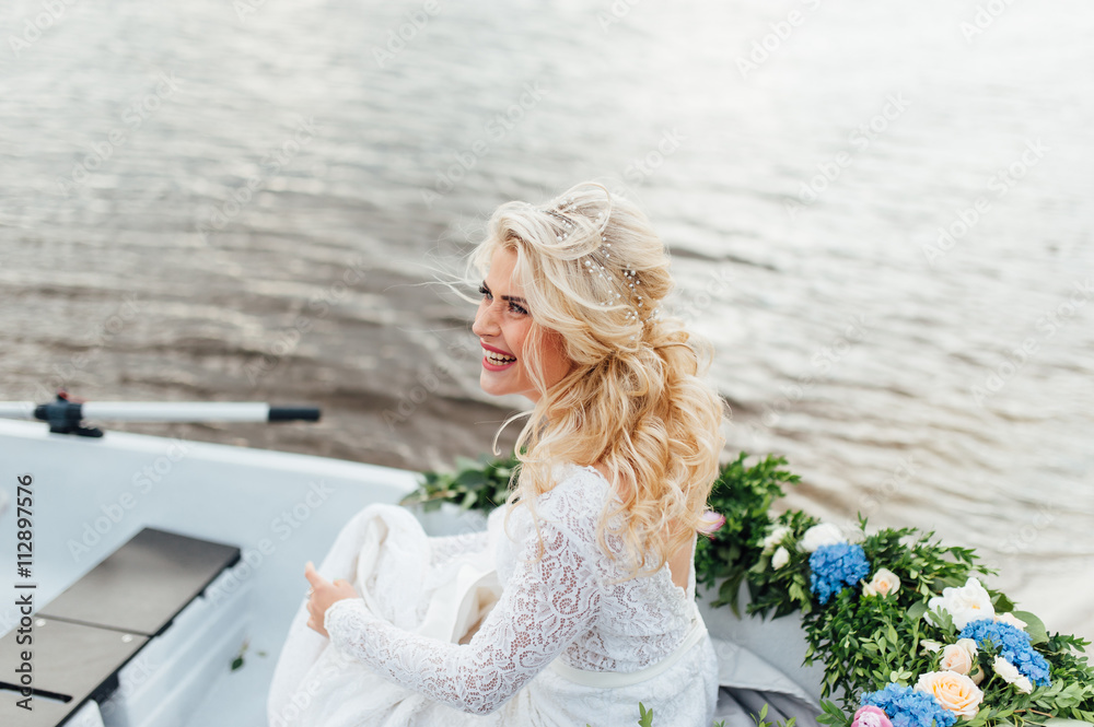 Fototapeta premium Beautiful young bride in luxury wedding dress