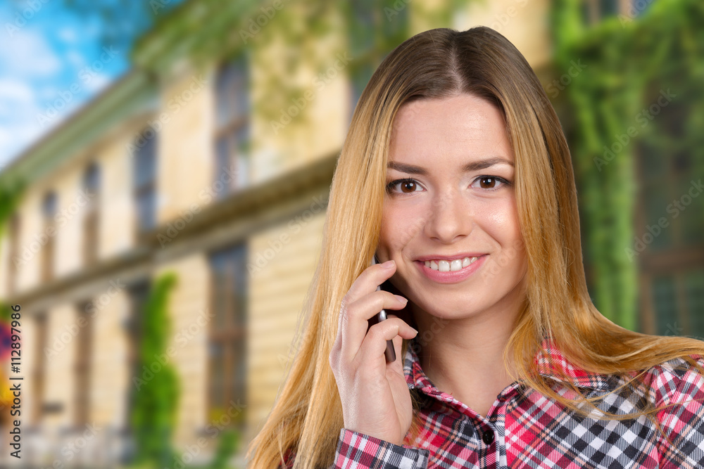 Young happy caucasian woman is calling with a mobile phone Young happy caucasian woman is calling with a mobile phone