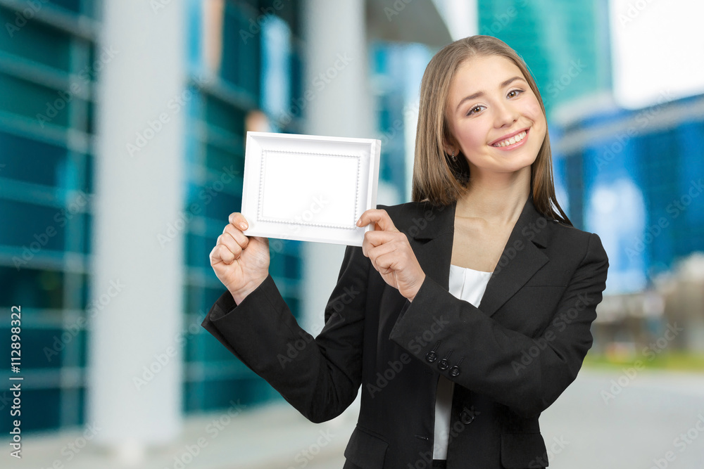 Beautiful happy smiling woman showing copy space Beautiful happy smiling woman showing copy space