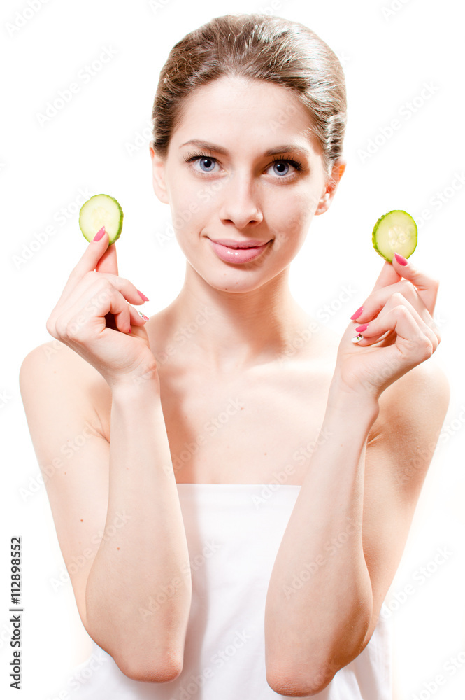 portrait of young attractive spa lady standing with slices of cucumber in the hands isolated on white background portrait of young attractive spa lady standing with slices of cucumber in the hands isolated on white background