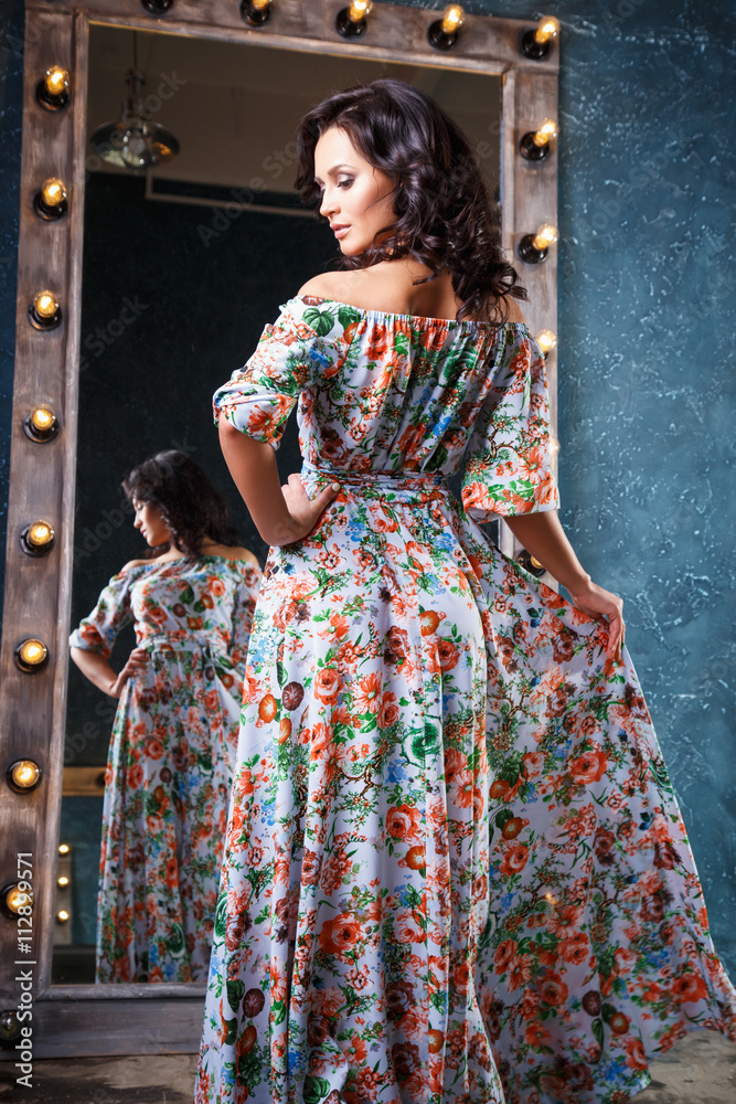 Fototapeta premium portrait of beautiful elegant young woman in gorgeous summer dress