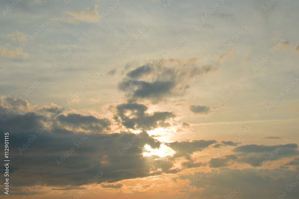 Sky with clouds at sunset background