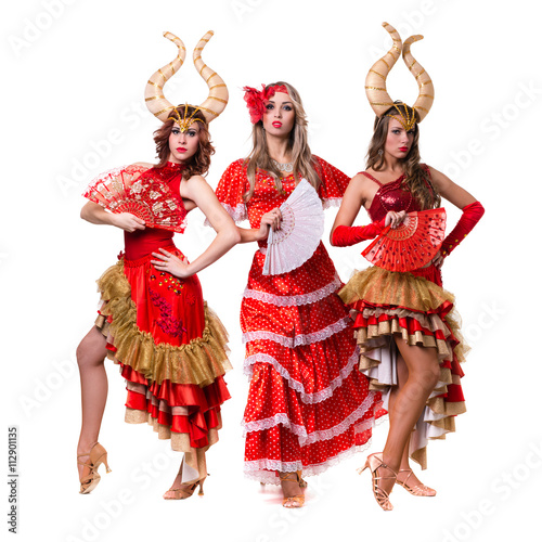 three women dancers with horns. Isolated on white background.