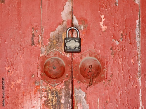 the locked decrepit wooden doors photo