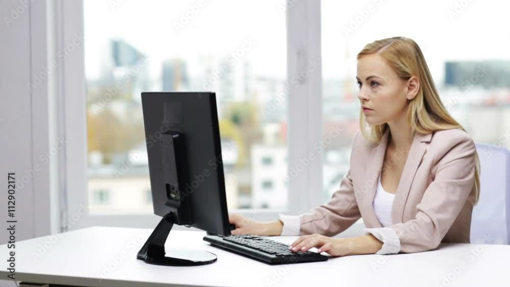young businesswoman with computer typing at office young businesswoman with computer typing at office