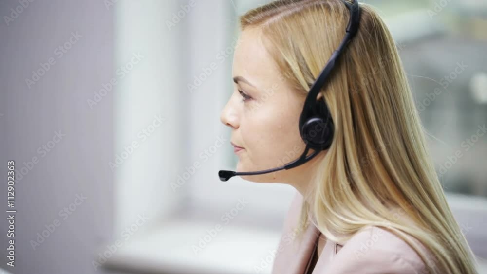 businesswoman with computer and headset talking businesswoman with computer and headset talking