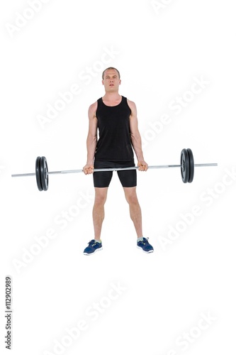 Bodybuilder lifting heavy barbell weights