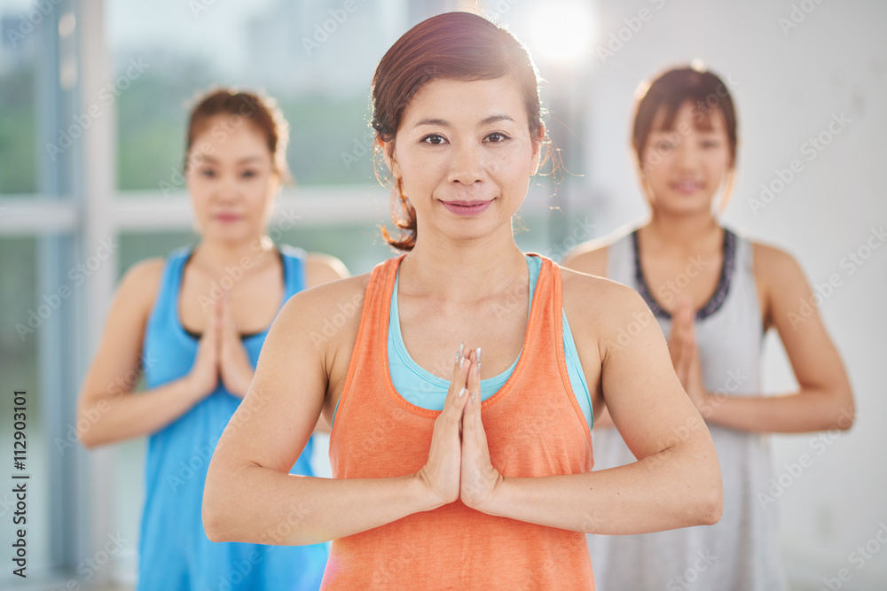 Asian yogies keeping hands in namaste gesture Asian yogies keeping hands in namaste gesture