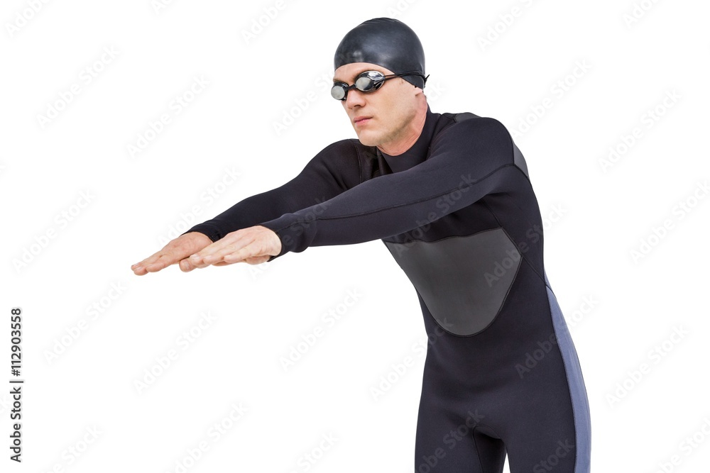 Swimmer in wetsuit while diving Swimmer in wetsuit while diving