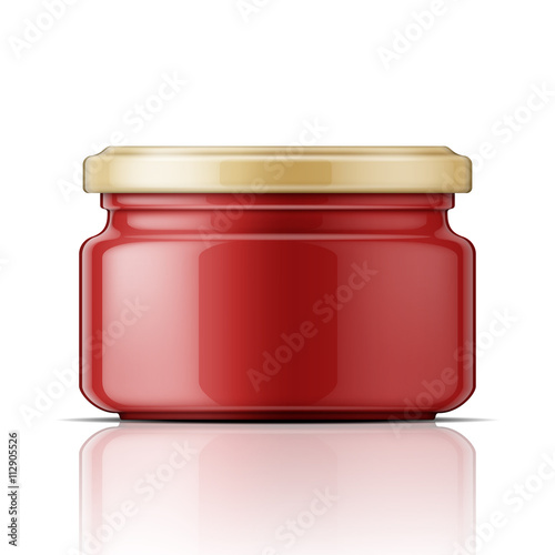 Glass jar with tomato sauce.
