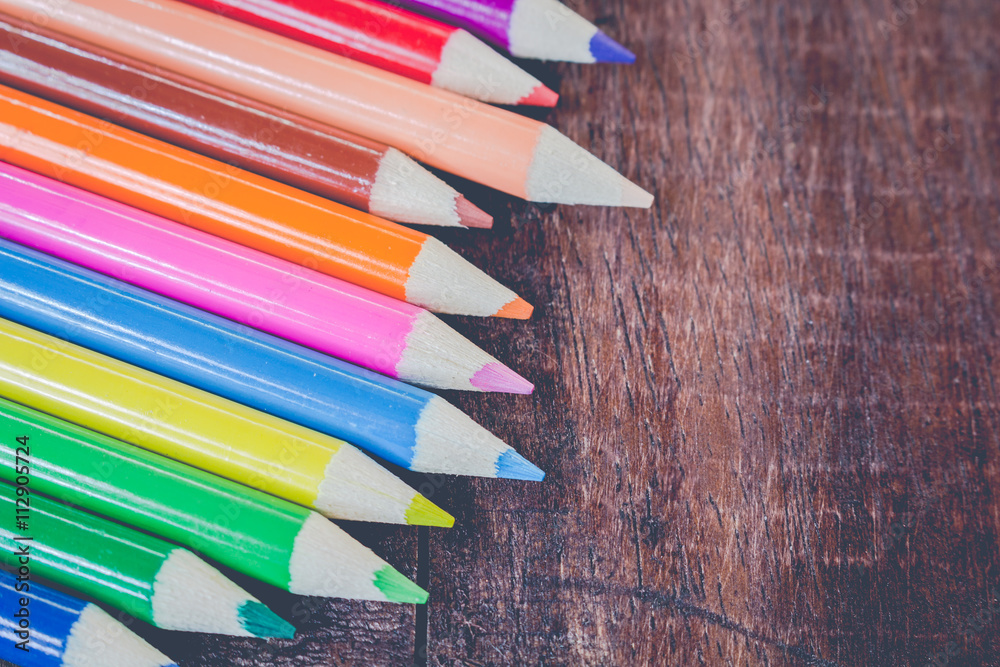 Crayons on wooden table background Crayons on wooden table background