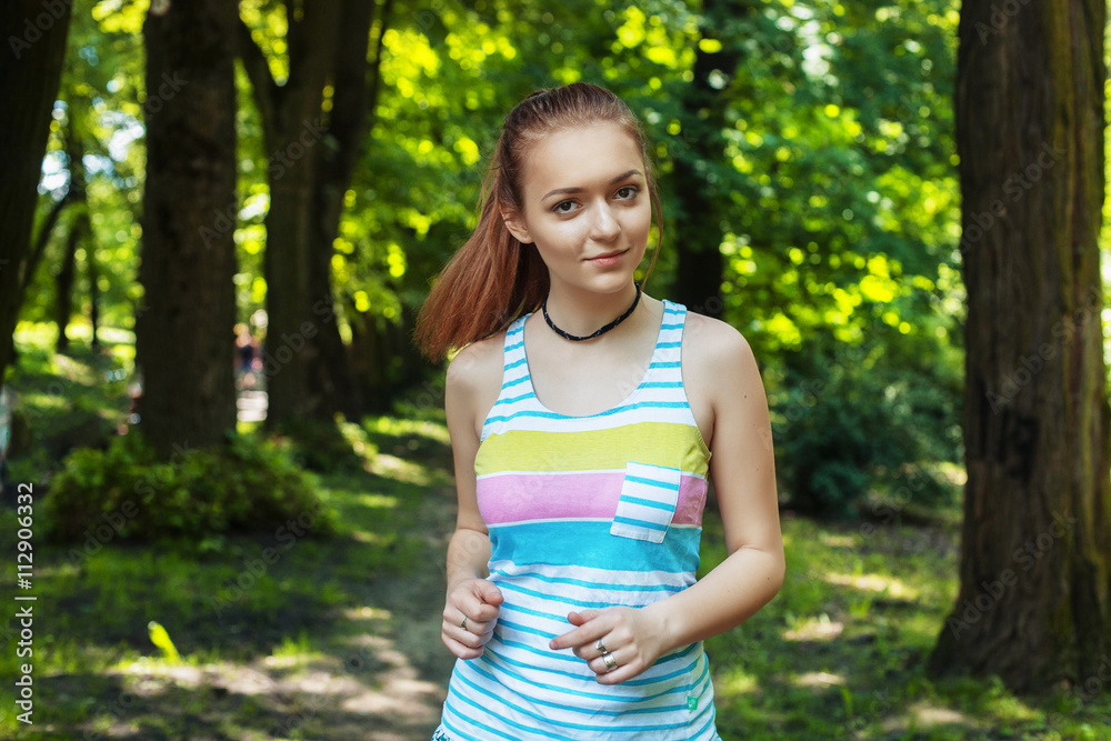 young girl running in the woods
