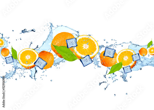 Water splash with fruits and ice cube isolated on white backgroud. Fresh orange