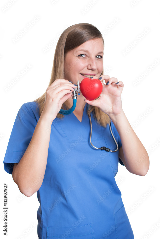 Woman doctor holding a red heart Woman doctor holding a red heart