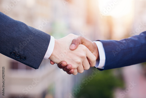 Shaking hands on a new business merger