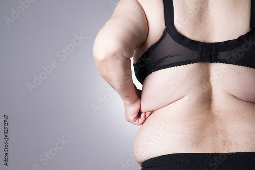 Fat female body with copy space. Back view