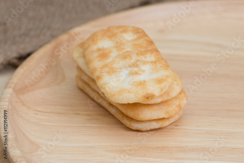 japanese rice cracker on wooden plate.