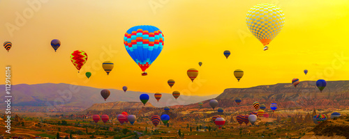 Canvas Print Colorful Hot Air Balloon In The Mountain sunrise