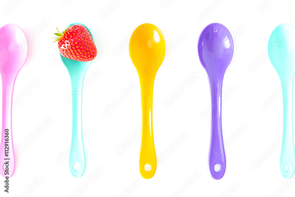 Strawberry on a bright saucer isolated white Strawberry on a bright saucer isolated white