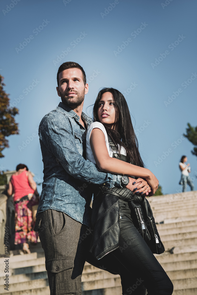 Couple posing together on the stairs