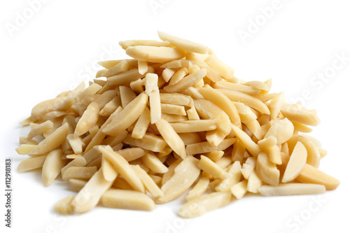 Fotografie Pile of peeled slivered almonds isolated on white.
