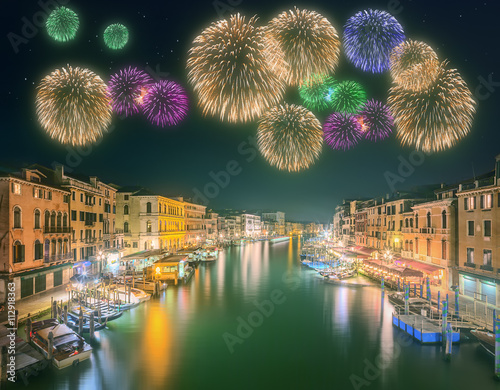 Beautiful fireworks under Grand Canal and buildings in Venice