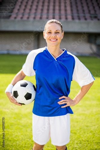 Portrait of female football player holding a ball © WavebreakMediaMicro