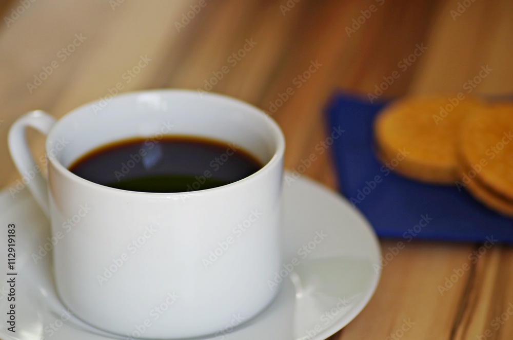 Coffee. Cup of coffee and chocolate cookies on rustic wooden table. Black coffee for breakfast. Hot drinks. Coffee. Cup of coffee and chocolate cookies on rustic wooden table. Black coffee for breakfast. Hot drinks.