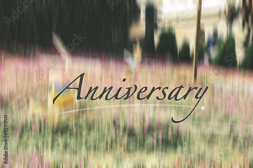 word anniversary over blurred background image with retro and vintage look.