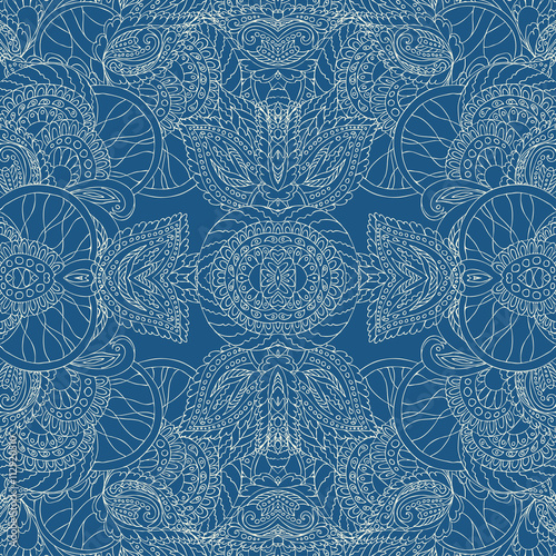 Paisley seamless pattern. Doodle, ink and pen. Linear drawing of a hand . Bright lace on gray-blue background.