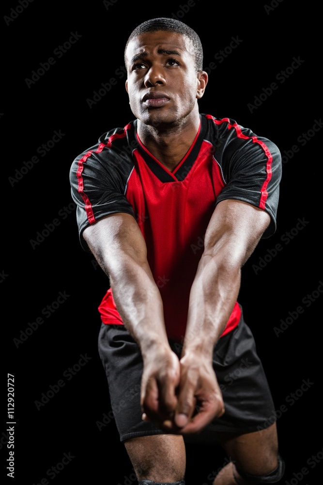 Sportsman posing while playing volleyball Sportsman posing while playing volleyball