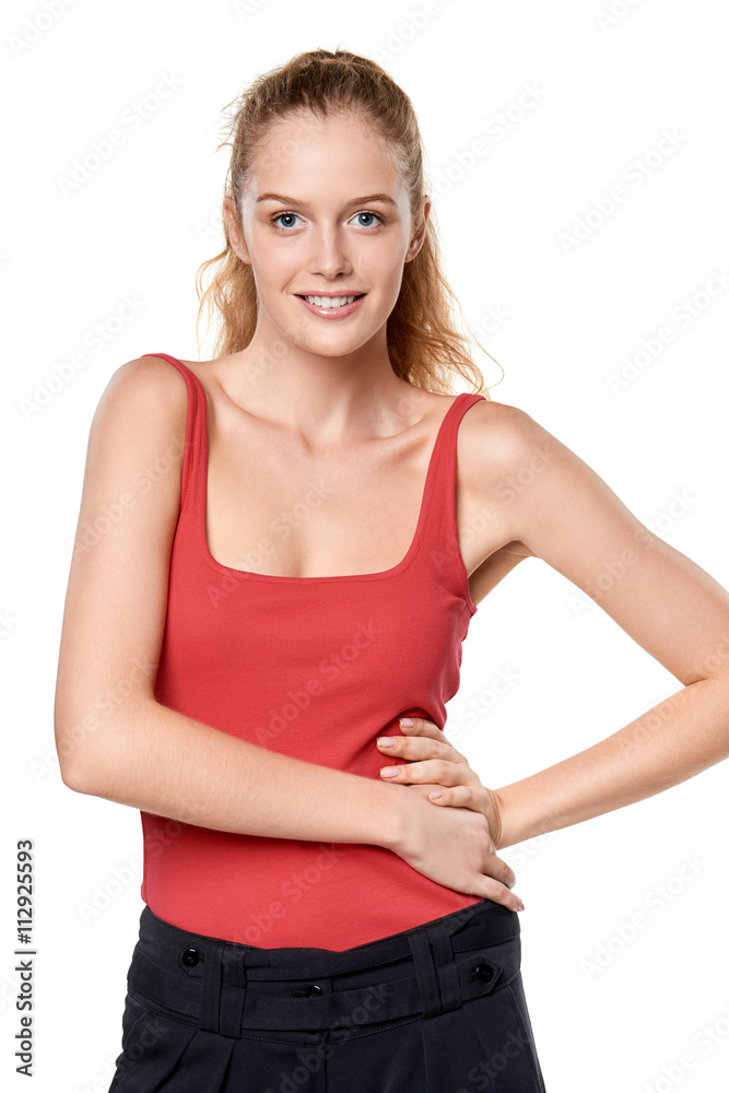 Beautiful blond teen girl in red top standing casually Beautiful blond teen girl in red top standing casually