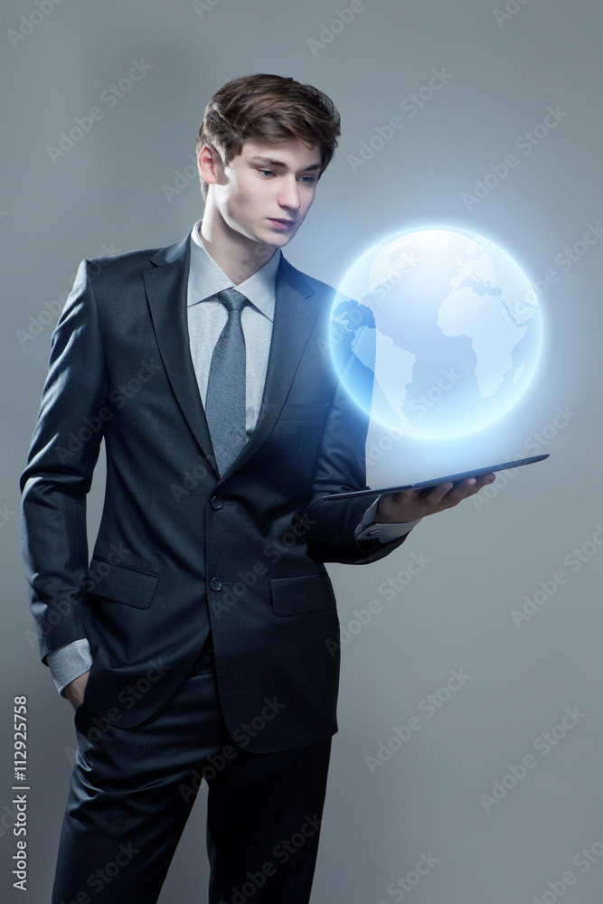 Young businessman with touch screen computer Young businessman with touch screen computer